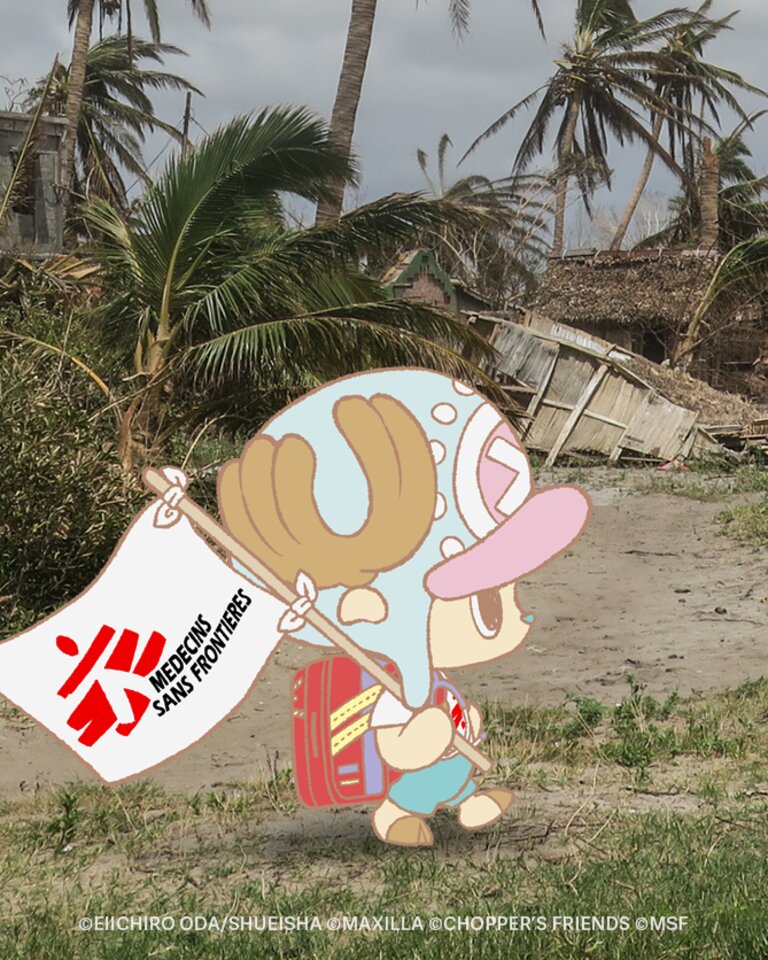 Chopper walking in front of some desctructed buildings
